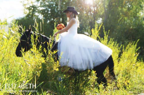 bride horseback riding at a ranch
