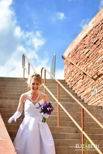 bride laughing while running down stairs
