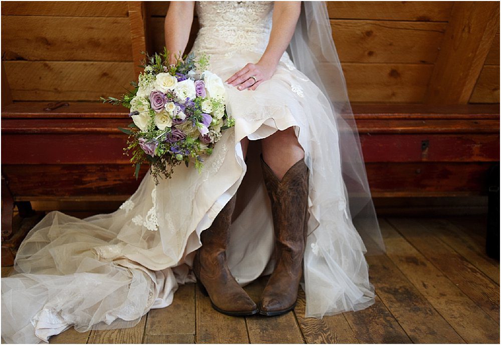 bride in cowboy boots, bridal portrait, bridal bouquet, wedding flowers, wedding dress and veil,evergreen barn wedding, mountain wedding planner, wedding planning colorado, rustic elegance
