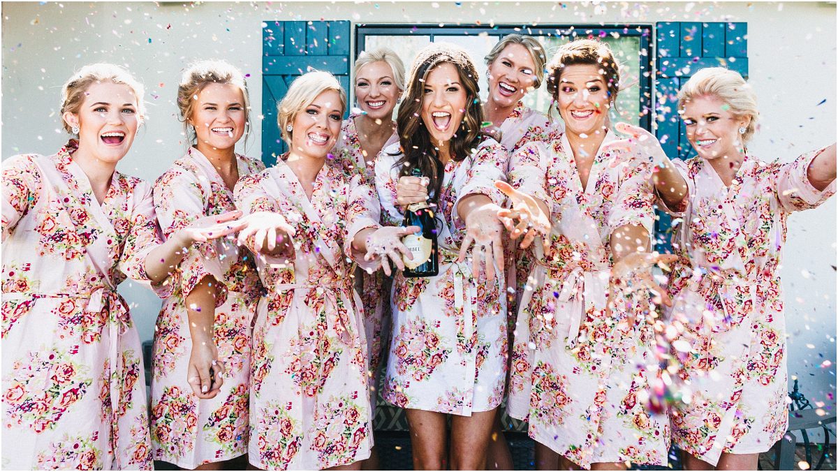 scottsdale wedding planner, bride getting ready, arizona weddings, bridesmaids, floral robes, popping champagne