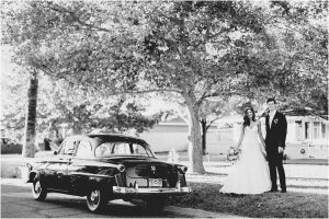 scottsdale wedding planner, getaway car, vintage ford, black and white image, bride and groom