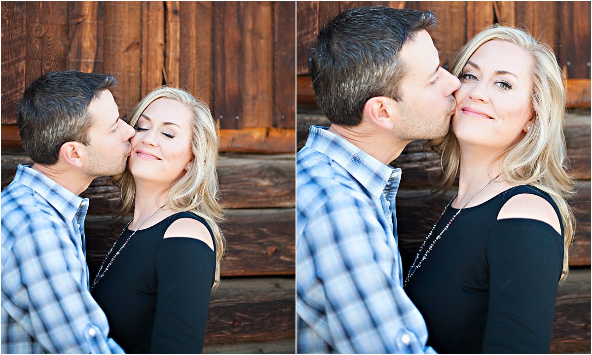 couple kissing in front of old wooden barn,clear creek history park, golden colorado engagement session, autumn, l elizabeth events, colorado engagement photography, mountain engagement photographer