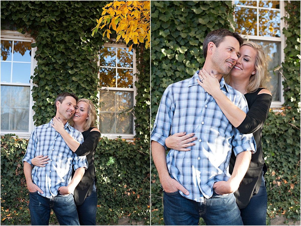 couple hugging in front of vine covered house,clear creek history park, golden colorado engagement session, autumn, l elizabeth events, colorado engagement photography, mountain engagement photographer