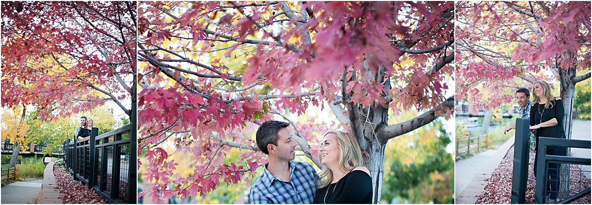 couple smiling at each other under red tree,clear creek history park, golden colorado engagement session, autumn engagement session, l elizabeth events, colorado engagement photography, mountain engagement photographer