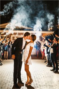 grand exit, sparkler exit, getaway dress, bride and groom kissing,outdoor reception, scottsdale wedding planner, arizona weddings