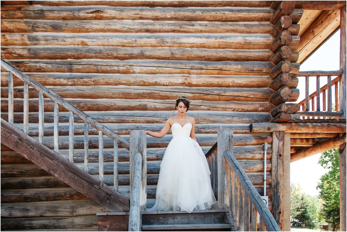 bride coming down the stairs, bridal portrait, dao house, estes park, colorado wedding planning, mountain wedding planner
