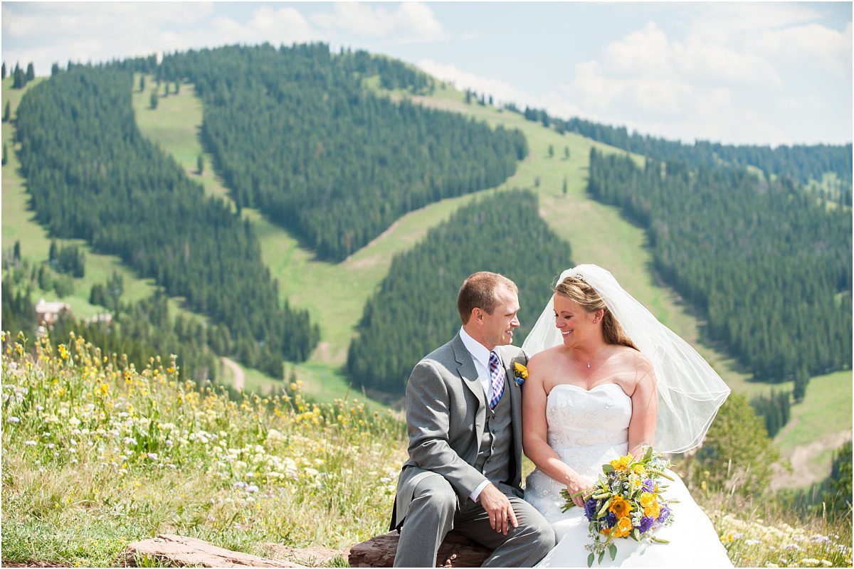 bride and groom portrait in front of ski slopes, donavan pavilion vail, colorado wedding photography, mountain wedding photographer