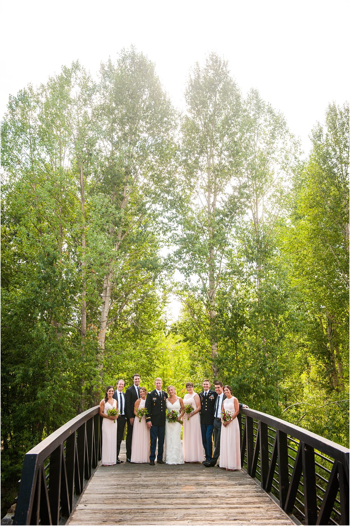 bridal party, wedding party portraits on bride in park, steamboat springs, river, colorado wedding photographer, mountain wedding photography