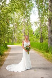 bridal portrait, bride alone on wedding day, steamboat springs park, bridal bouquet, lace wedding dress, colorado photographer, mountain weddings