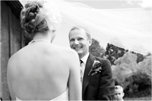 bride and groom during outdoor ceremony at clear creek history park, black and white image, bride's veil blowing in the wind, colorado wedding photographer, mountain wedding planner
