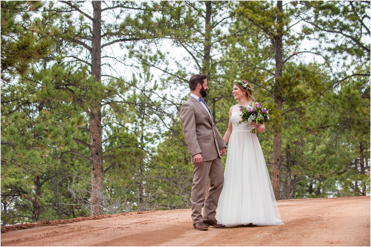 couples portraits on dirt road at tishreed mountain lodge wedding