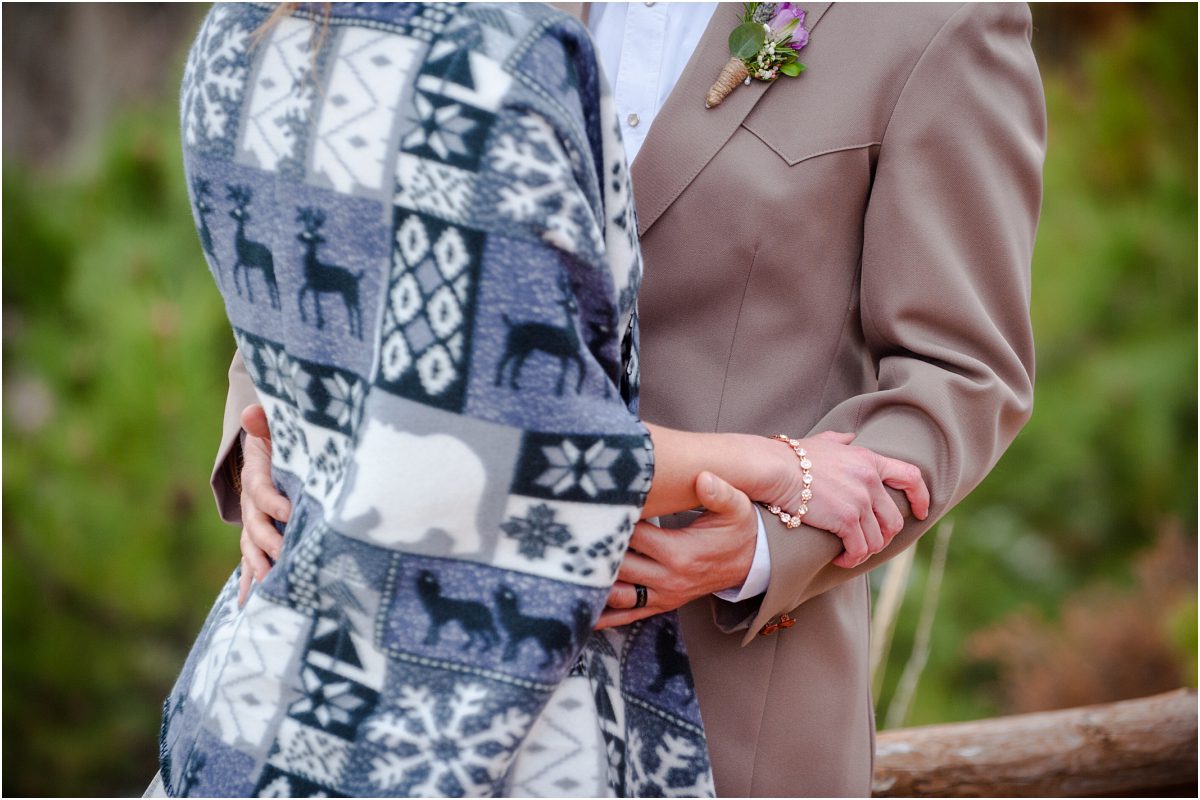 purple boutonniere, handmade fleece shawl, bride and groom portraits