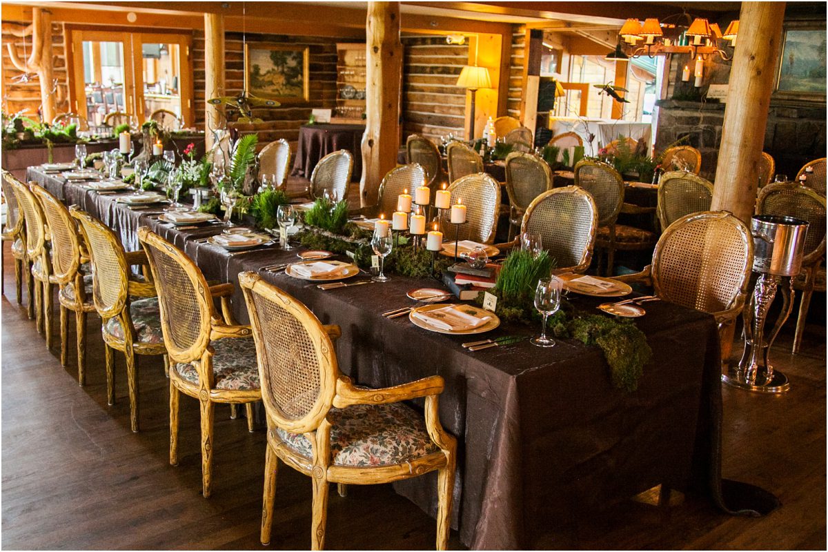 log wood chairs, forest theme table, organic tablescape, nature inspired wedding, keystone ranch, moss, wood, candles, books, ferns, brown table linen