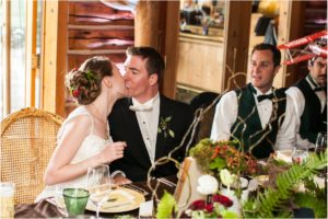 couple kissing, forest theme wedding, keystone ranch