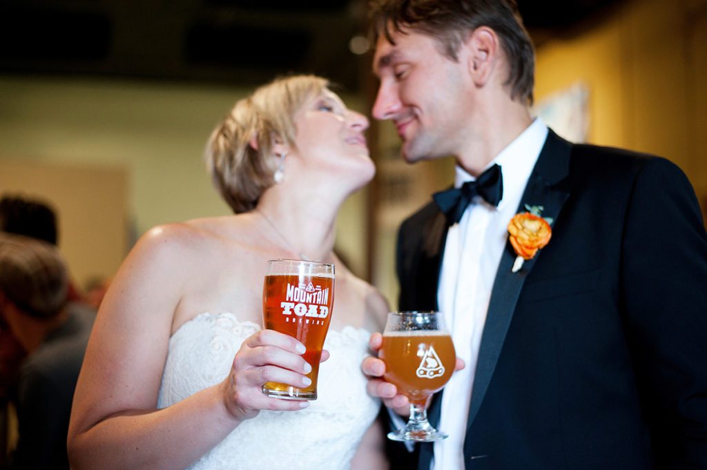 bride + groom, couple holding mountain toad beers