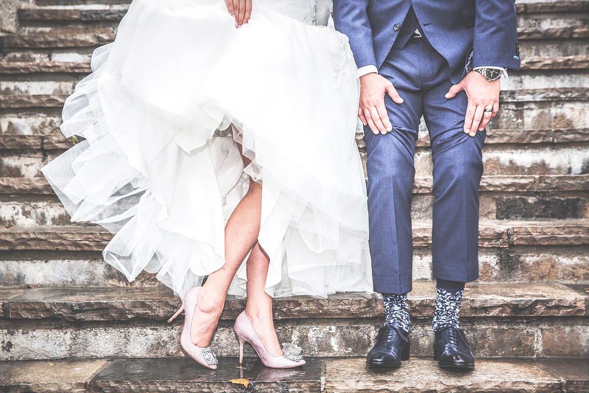 married couple showing their shoes, socks.ask the wedding experts, wedding planning event