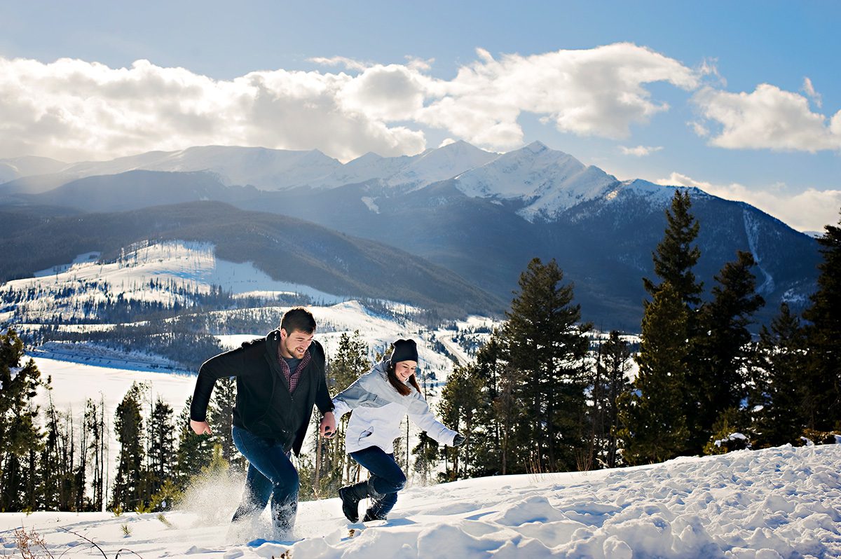 couple running in snow, proposal tip 1, engaged in colorado